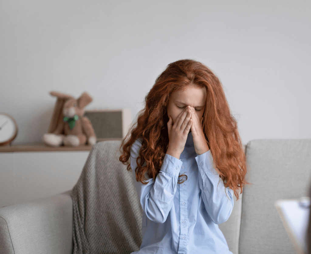 Teen girl crying as she deals with addiction as a teen